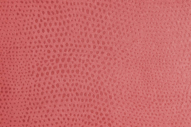 istock Cloth structure of  jacquard red fabric with abstract shabby spotted texture closeup, macro 2192367457