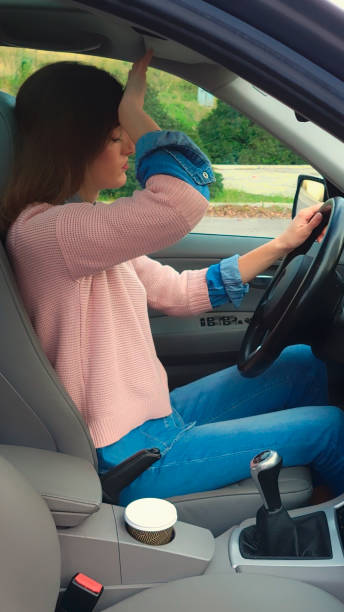 istock Young woman feeling fatigue while driving car 2192368971