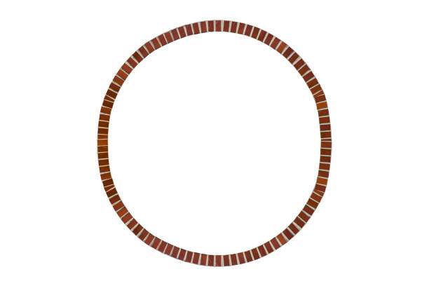 Circle window lined with dark brown glazed ceramic tiles is isolated.