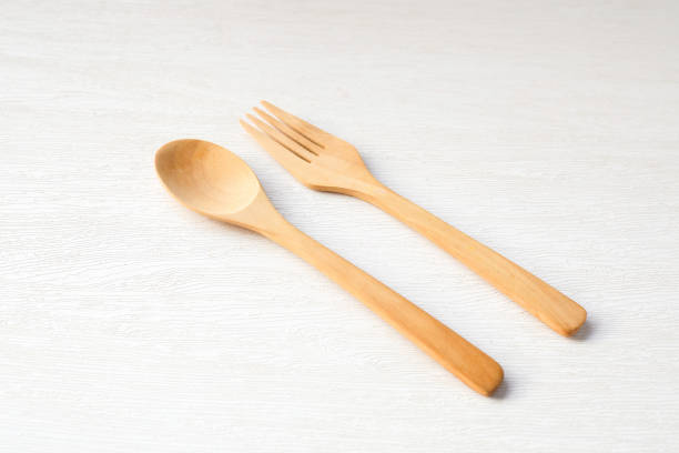 istock Wooden spoon and fork on white background 2192370434