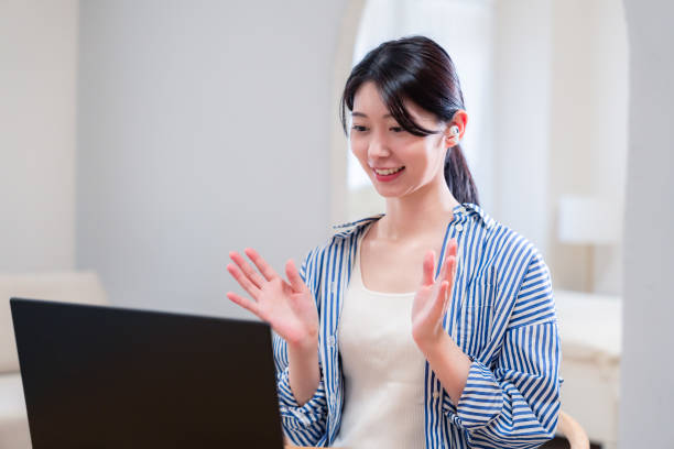 istock Young female employee participating in remote meetings from home 2192371674