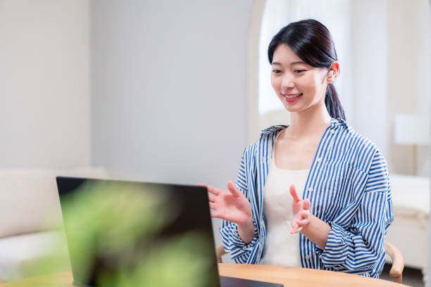 istock Young female employee participating in remote meetings from home 2192371678