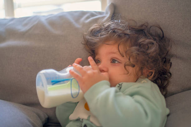 istock Baby enjoying a cozy milk moment 2192372318