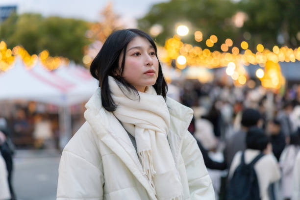 istock Young woman visiting Christmas market after work 2192376411