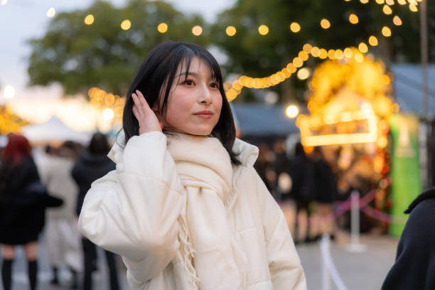 istock Young woman visiting Christmas market after work 2192376456