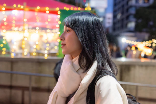 istock Young woman visiting Christmas market after work 2192376486