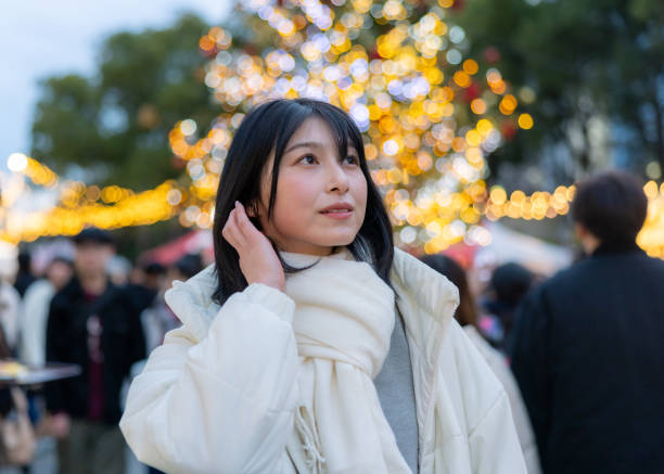 istock Young woman visiting Christmas market after work 2192376500