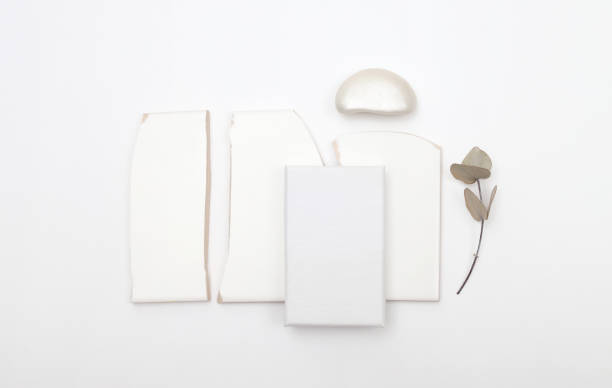 istock Empty  Blank texture canvas paper card, stones, twig with copy space for your text message. Minimalism style template background. Flat lay, top view. 2192380061