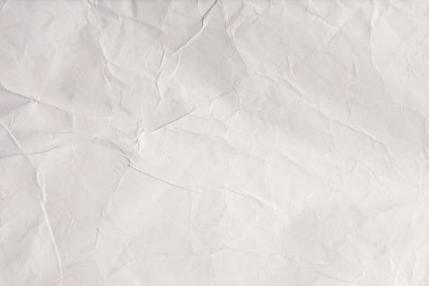 Crumpled wet craft paper blank texture copy space background.