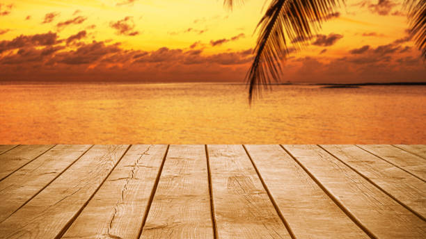 istock Empty wooden table top with tropical ocean sunset background 2192387389