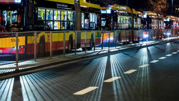 Lisbon, Portugal - Feb 10, 2018: Night scene with Portuguese people - men women inside public transportation yellow bus