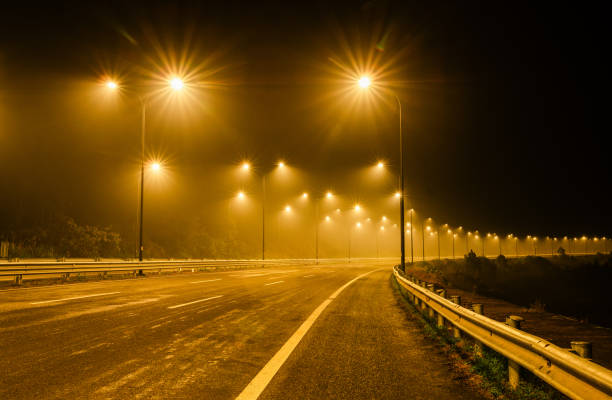 Street lights by the roadside at night