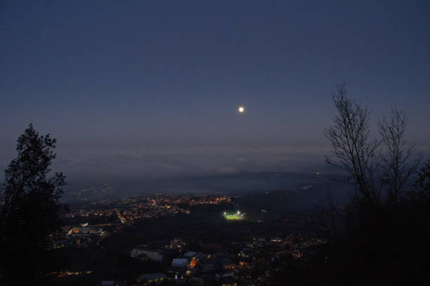 istock view from San Marino towards the Romagna plain with the fog against the sky and the full moon 2192394545