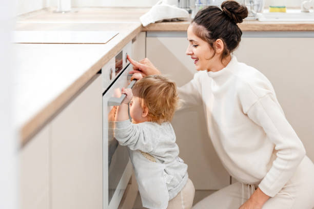 istock Mother and son baking cookies together in the kitchen 2192396195