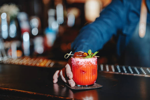 istock Close-up of a bartender serving a refreshing drink at the bar 2192397317