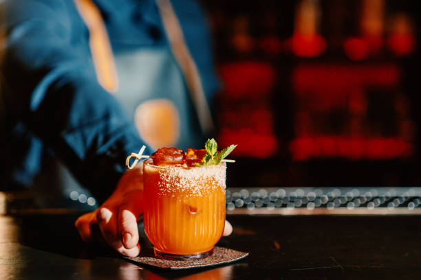 istock Close-up of a bartender serving a refreshing drink at the bar 2192397320