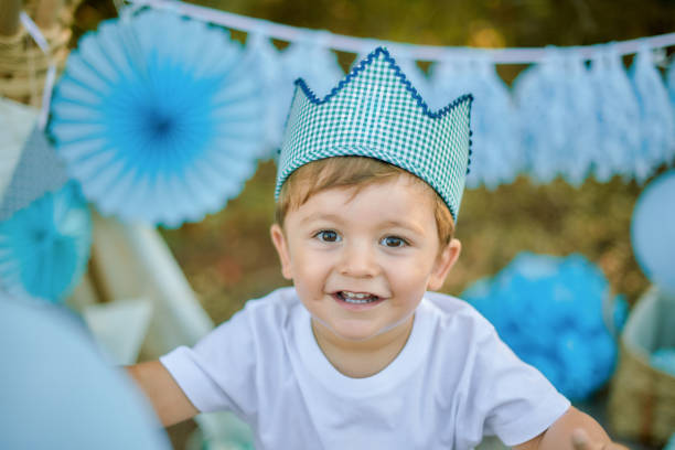 istock Toddler celebrating with balloons and decorations outside 2192401904