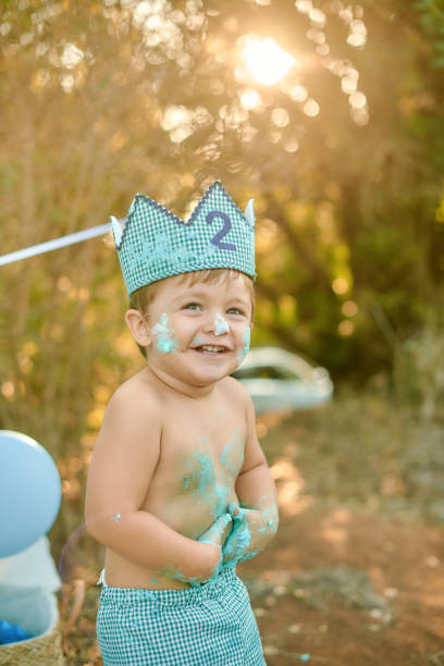 istock Toddler celebrates second birthday with cake smash outdoors 2192402604