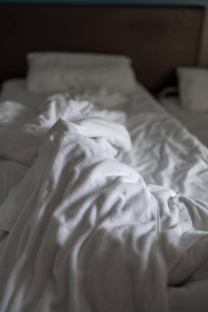 istock White bed background, after sleep at hotel. 2192402965