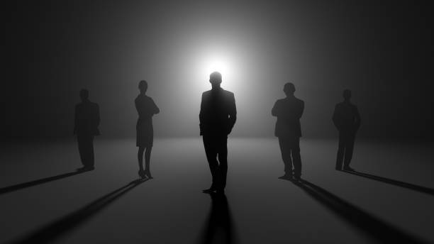 five black silhouettes on a black background