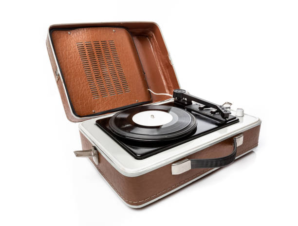 istock Vintage foldable portable vinyl player with a black sinlge vinyl plate on a turntable. 2192406540