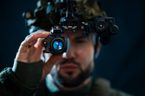 istock A soldier using binocular night vision in the darkness. 2192406728