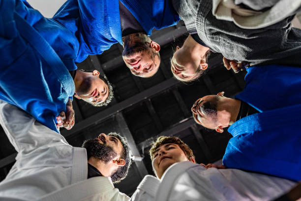 istock Athletes huddling during Jiu-jitsu class at gym 2192407027