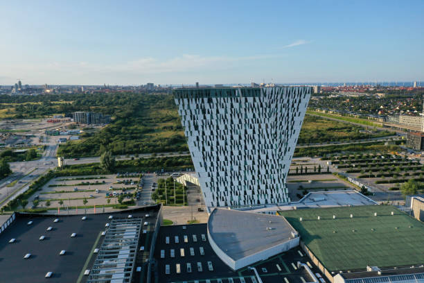 The AC Hotel Bella Sky Copenhagen, formerly the Bella Sky Comwell Hotel, is a 4-star conference hotel adjacent to the Bella Convention and Congress Center in the Ørestad district of Copenhagen, Denmark. The image shows the hotel with several other buildings in Ørestad.