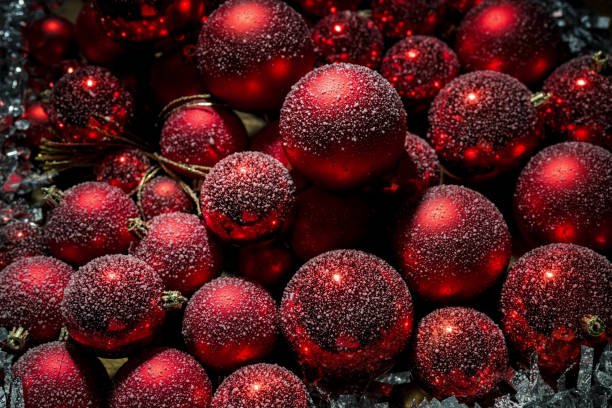 istock Christmas scene with snow falling on red tree balls decorations, Happy New Year 2192414391