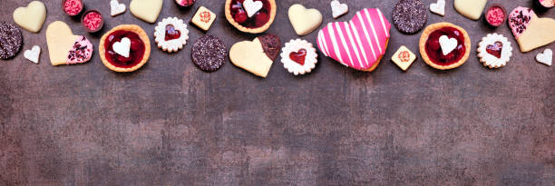 istock Valentines Day baking and sweets top border on a dark stone banner background 2192414536