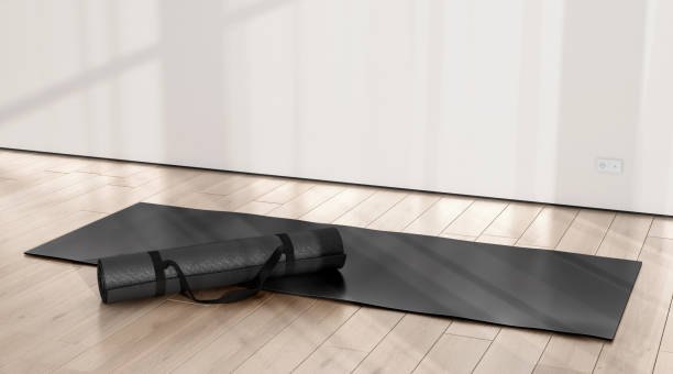 istock Blank black rolled unfolded yoga mat in sport area mockup 2192416863