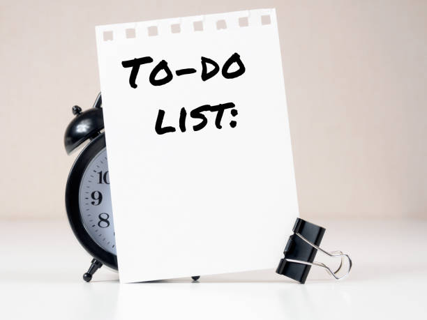 To-do list header on white note paper background alarm clock