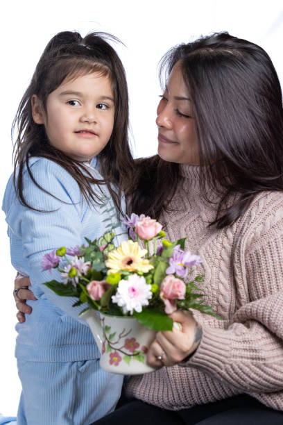 istock A young mother is receiving a gift from her daughter. 2192424638
