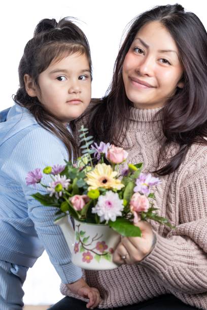 istock A young mother is receiving a gift from her daughter. 2192424659