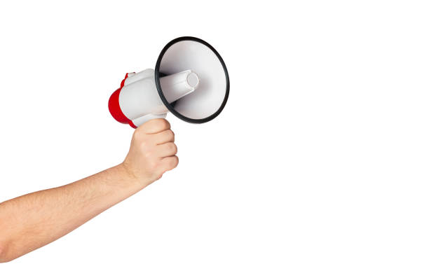 istock Male hand holding loudspeaker megaphone isolated on white background 2192424881