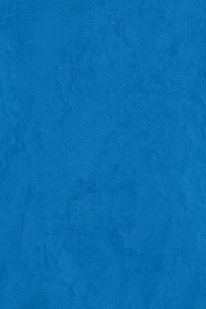 istock saturated blue colored low contrast Concrete textured background 2192424923