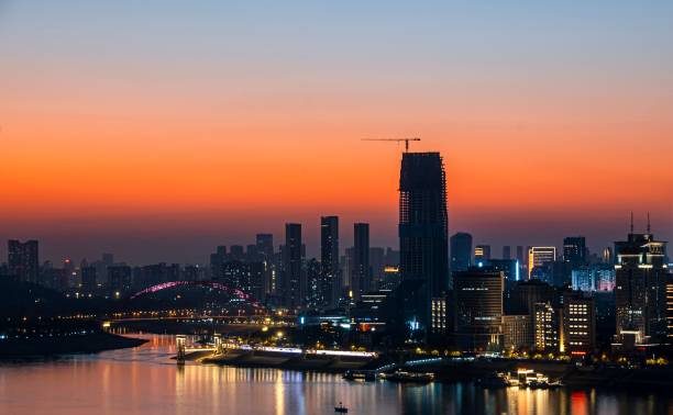 istock City skyline at sunset with vibrant orange sky. 2192426265