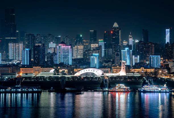 istock Vibrant city skyline at night with reflections. 2192426268