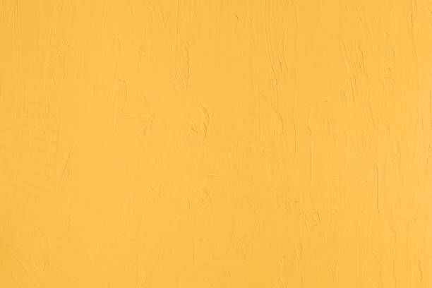 istock Saturated pastel yellow low contrast Concrete textured background 2192426557