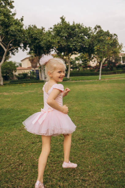 istock Joyful Ballerina Twirling Outdoors 2192428109