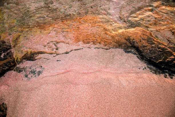 Drone Aerial view on water bay with rocks and pink sand, Crete island, Greece. Beautiful sea coastline on Elafonisi beach  from above