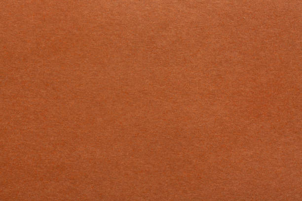 istock Brown paper sheet fabric texture. Brown canvas cardboard texture as a background. Brown paperboard photographic background 2192429943