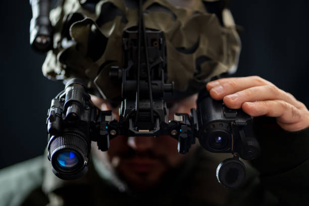 istock A soldier using modern binocular night vision in the darkness. 2192432513