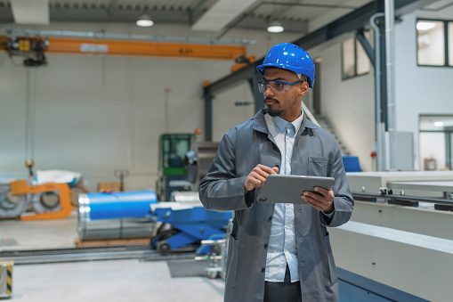 Engineers Blue Function Engineer With Blue Helmet And Safety Goggles Operating A Control Panel ...