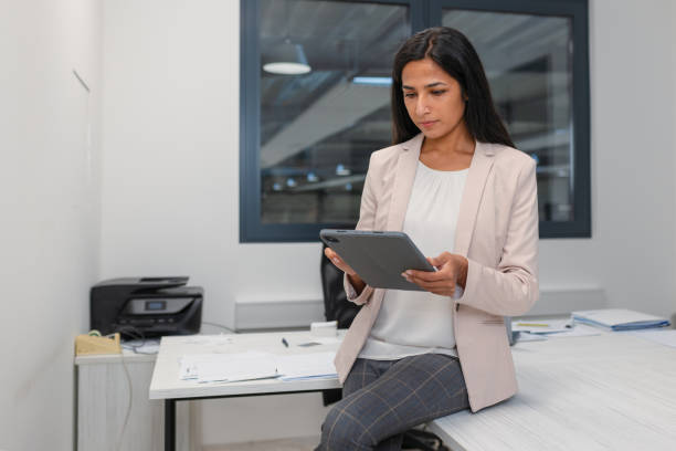 istock Indian businesswoman working on a tablet 2192434995