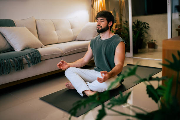 istock Hispanic Brazilian brunette bearded man practicing breathwork in his living room 2192437479