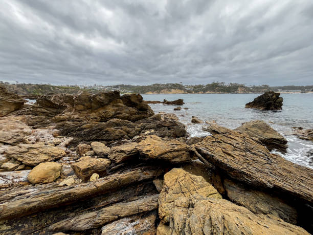 istock A rocky coastline highlights sandstone cliffs featuring shale intrusions and brilliant quartz seams, showcasing intricate natural patterns 2192439491