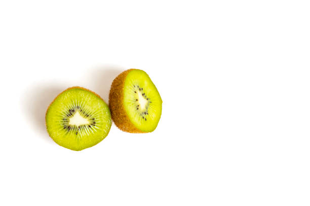 Fresh Green Kiwi Fruit Cut in Half on White Background