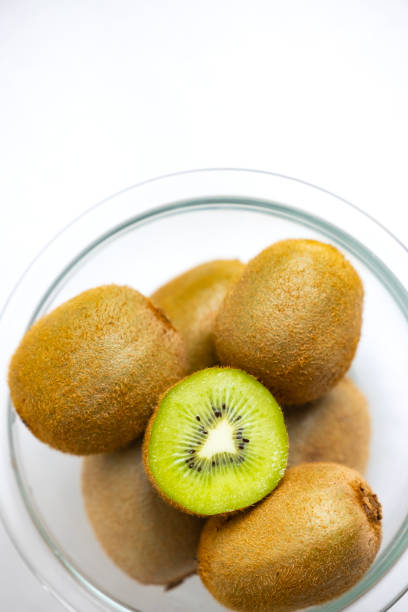istock Fresh Green Kiwi Fruit Cut in Half on White Background 2192439634