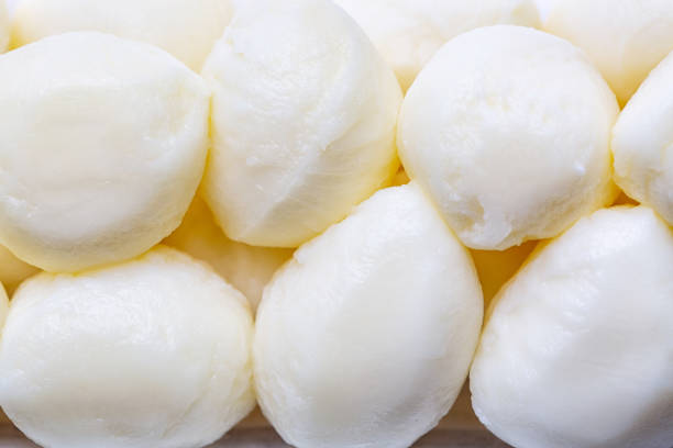 Italian mozzarella cheese balls close up as a background.